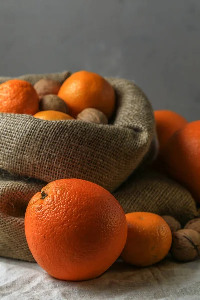 Ripe Tasty Juicy Oranges Tangerines Canvas Bag Walnuts Table — Stock Photo, Image