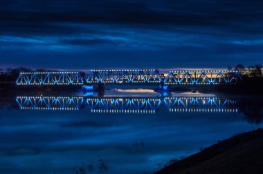 Illuminated railway bridge at sunrise 2 clipart