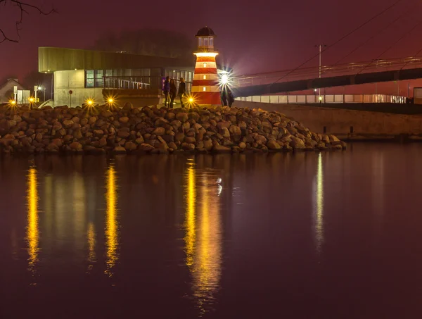 Bridge with reflection in the water at night