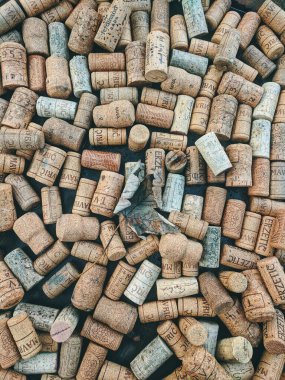 10.10.2020. Ukanc, Slovenia. Background of many vintage wine corks on the table in restaurant. Top view. Party and holiday concept. 