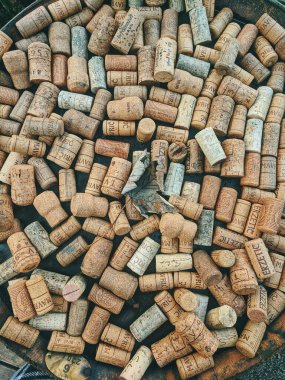 10.10.2020. Ukanc, Slovenia. Background of many vintage wine corks on the table in restaurant. Top view. Party and holiday concept. 