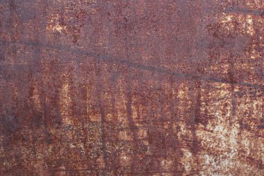 Paslı arka plan, yakın plan paslı kırmızı metal yıpranmış eski yüzey. 