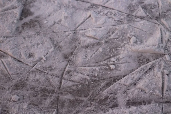 Surface of Ice Rink in Snow with Skate Tracks