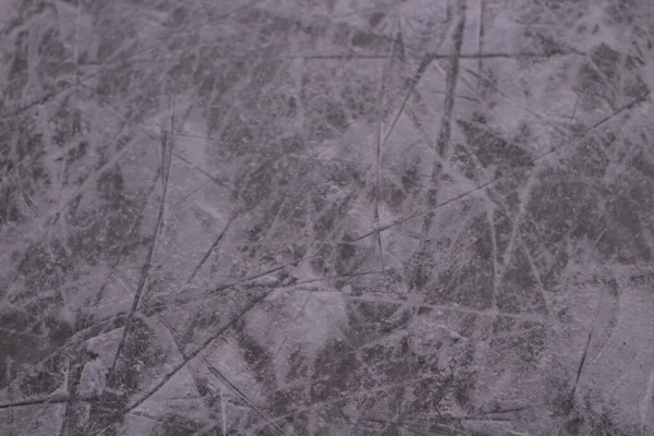 Surface of Ice Rink in Snow with Skate Tracks