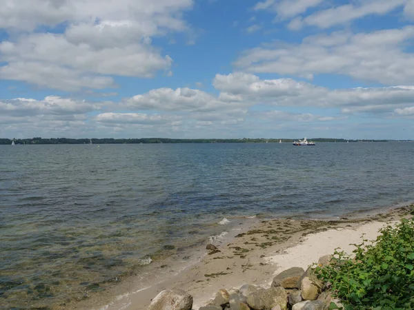 stock image the beach and the castle of gluecksburg in germany