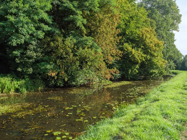 stock image the village of Marienthal and the river issel