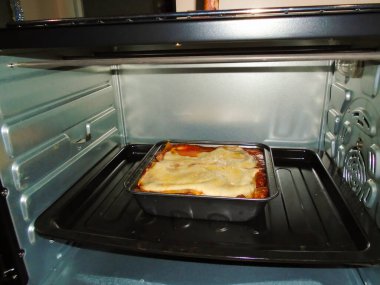 Homemade Lasagne is baking in a hot oven