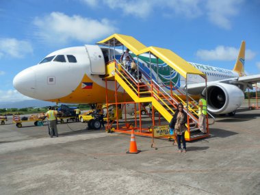Airbus A320 is parking a the apron at the international airport in Manila on the Philippines 14.12.2012