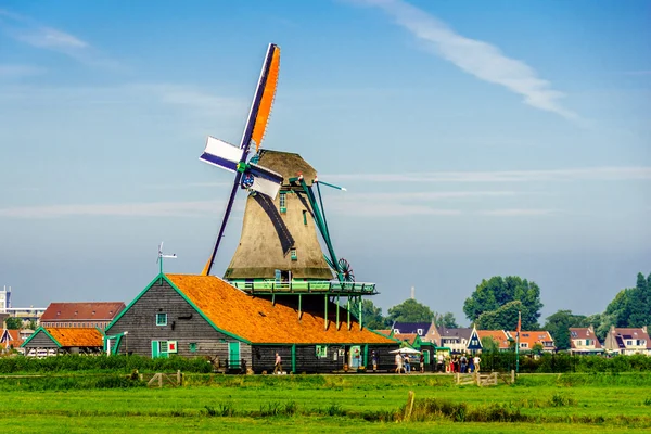 Fully operational historic Dutch Windmills along the Zaan River at the village of Zaanse Schans in the Netherlands — Stock Photo, Image