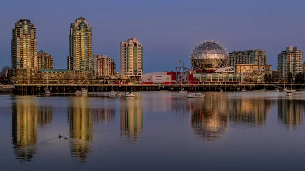 Vancouver Skyline at Sunset at the Eastern Shore of False Creek Inlet with the Science Center Globe in British Columbia, Canada
