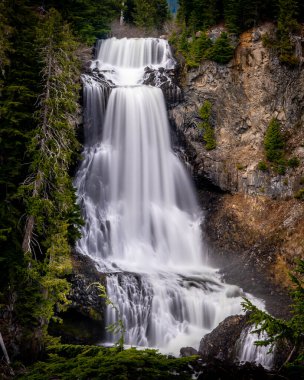 Spring snow melt makes for beautiful Alexander Falls, a waterfall on Madeley Creek, in the Callaghan Valley near Whistler British Columbia, Canada