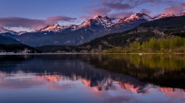 Blue Hour after the sun has set over the Garibaldi Range and the Mountains Reflecting on the smooth surface of Green Lake near Whistler, British Columbia, Canada