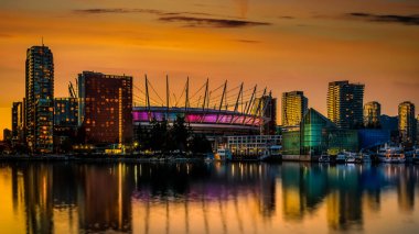 Sunset over the Yaletown District on False Creek and the BC Place Stadium in Vancouver, British Columbia, Canada
