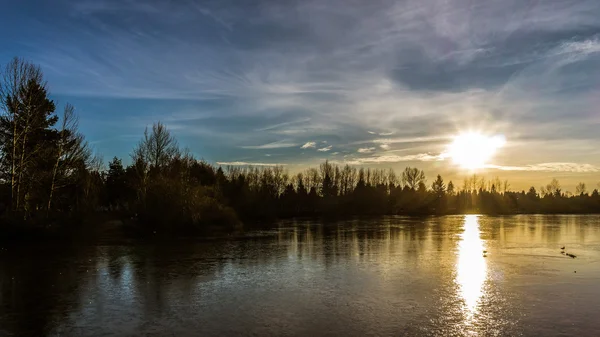 Sunset over frozen Mill Lake in Abbotsford BC — Stock Photo, Image