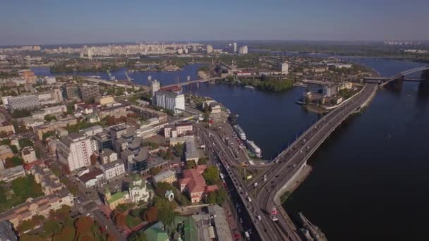 Aerial view on a traffic jam on the embankment of big river — Stock Video