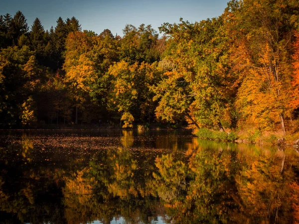 Autumn season with full colors reflection in lake.