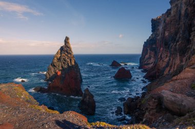 Panoramic view of dramatic cliffs and rugged coastline at Ponta de Sao Lourenco, Madeira island, Portugal. Famous hiking trail and volcanic landscape surrounded by the blue Atlantic ocean.