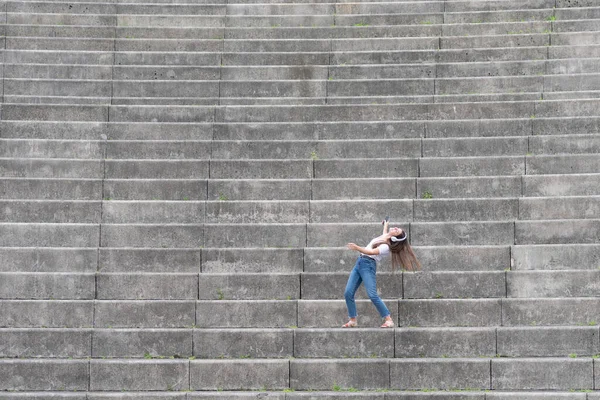 Happy Woman Listening Music Dancing Alone Stairs Grandstand — Stock fotografie