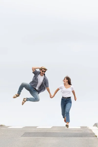Happy Couple Running Jumping Road Celebrating Success Happiness Concept Minimalist — Stock Photo, Image
