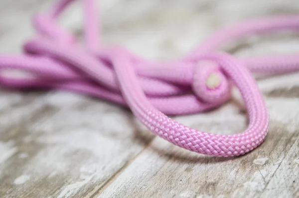 Bright pink gymnastics sport rope — Stock Photo, Image