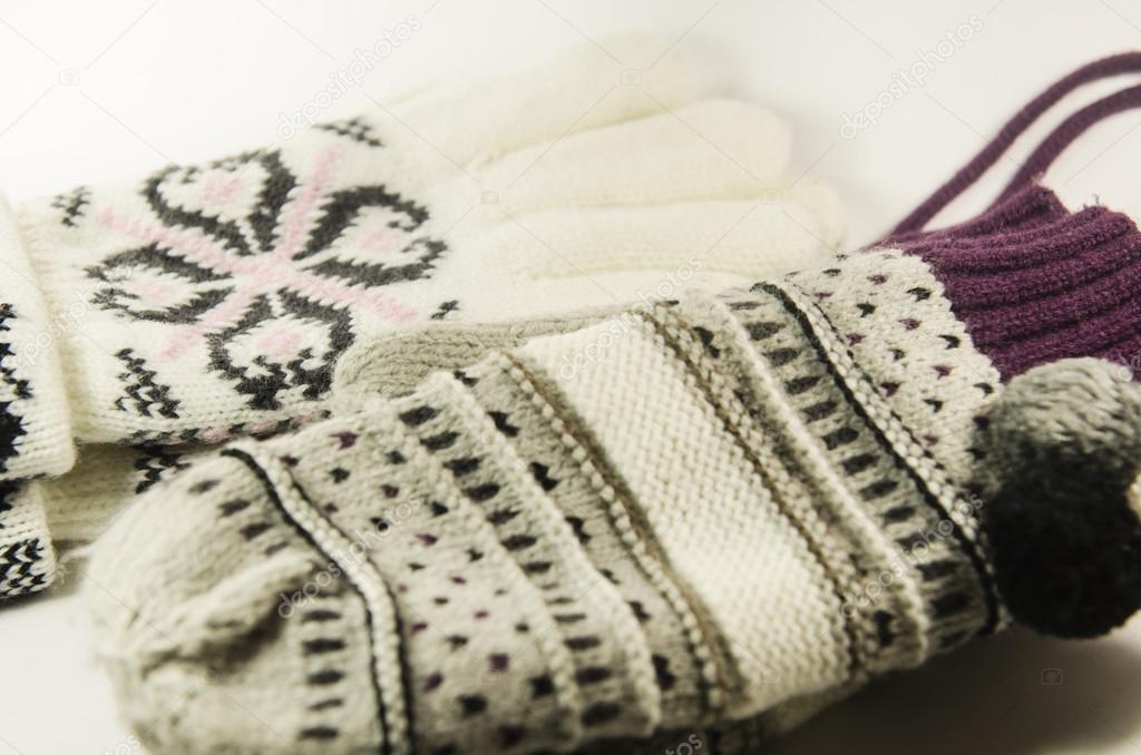 Natural woolen gloves and mittens isolated on white background.