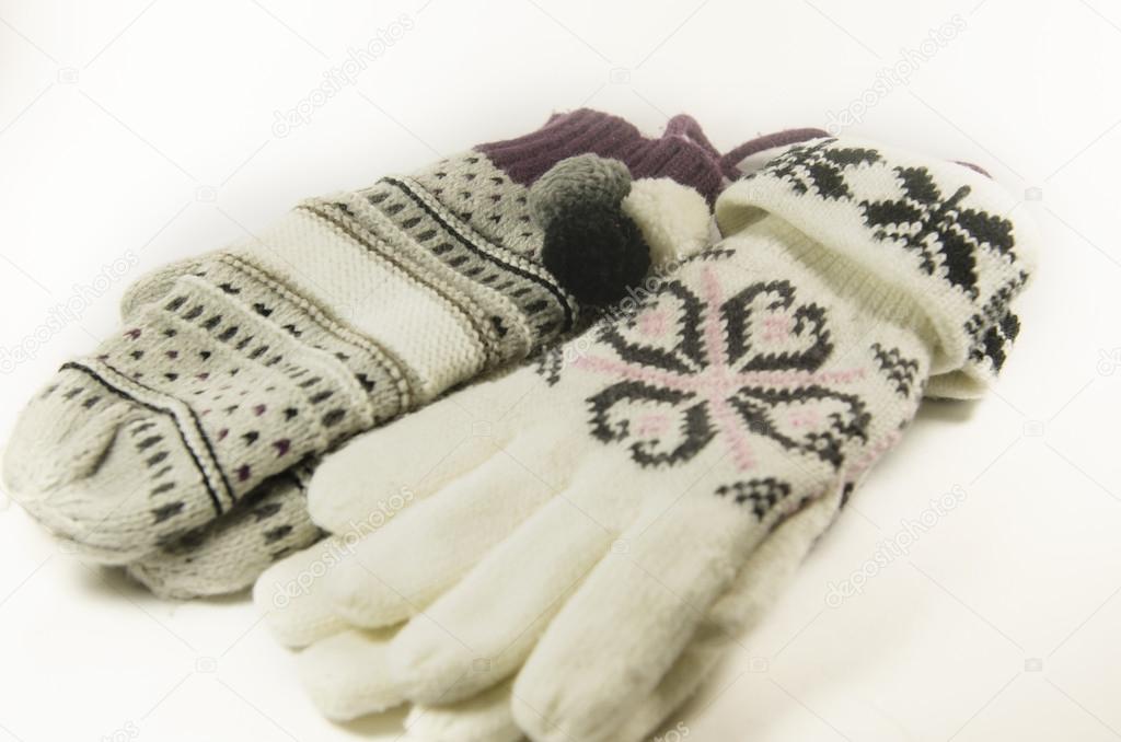 Natural woolen gloves and mittens isolated on white background.