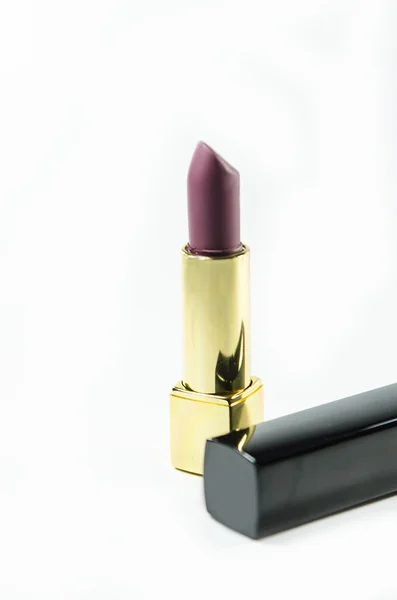 Lápiz labial elegante y glamuroso aislado sobre fondo . — Foto de Stock