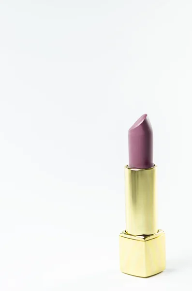 Lápiz labial elegante y glamuroso aislado sobre fondo . — Foto de Stock