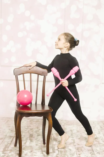 gymnastic girl in white training room