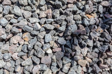 Sert taş. Çok sayıda taş. Taşların dokusu. İnşaat için malzeme