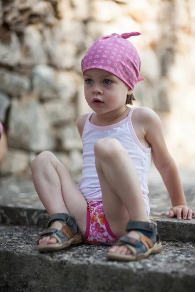 Cute little pensive girl looking for someone or something — Stock Photo, Image
