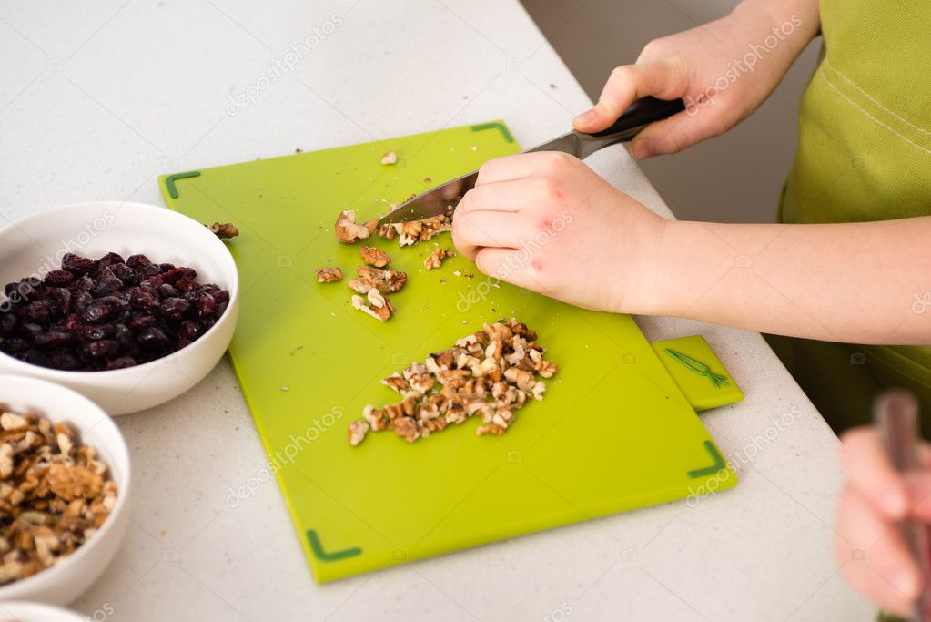 Chopping walnuts with a knife