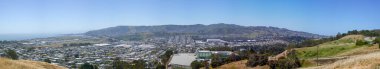 Panoramic view of San Bruno Mountain and san mateo county taken from John McLaren Park on a clear sunny day clipart