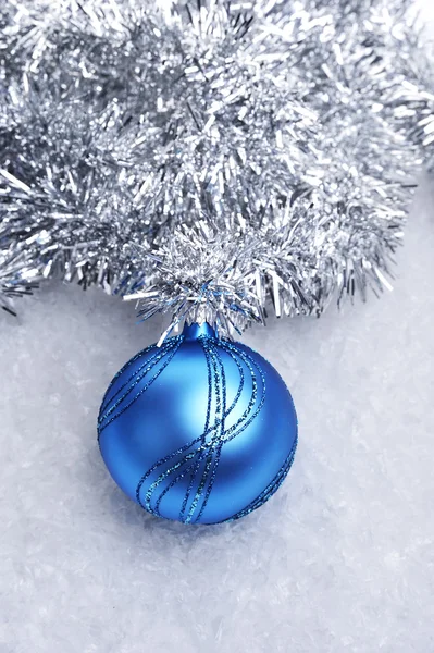 Blue Christmas ball in the snow — Stock Photo, Image