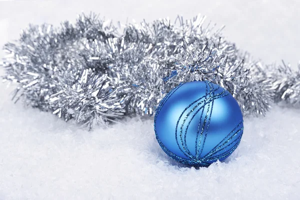 Blue Christmas ball in the snow — Stock Photo, Image