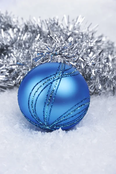 Blue Christmas ball with Christmas chains — Stock Photo, Image