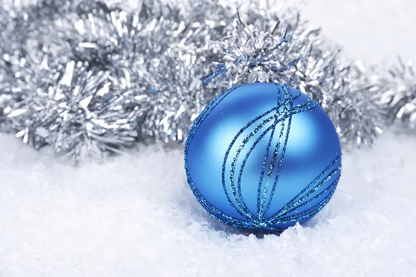 Blue Christmas ball in the snow — Stock Photo, Image