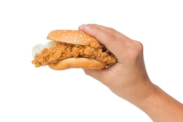 Mão segurando um hambúrguer de frango frito isolado em branco — Fotografia de Stock