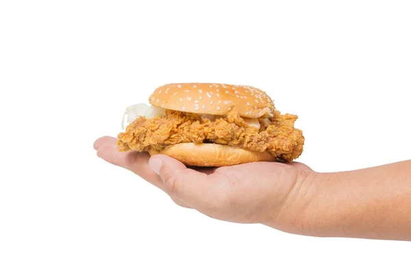 Mão segurando um hambúrguer de frango frito isolado em branco — Fotografia de Stock