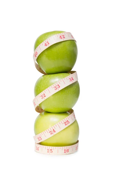 Skládaný jablka s páskou opatření, izolované na bílém — Stock fotografie