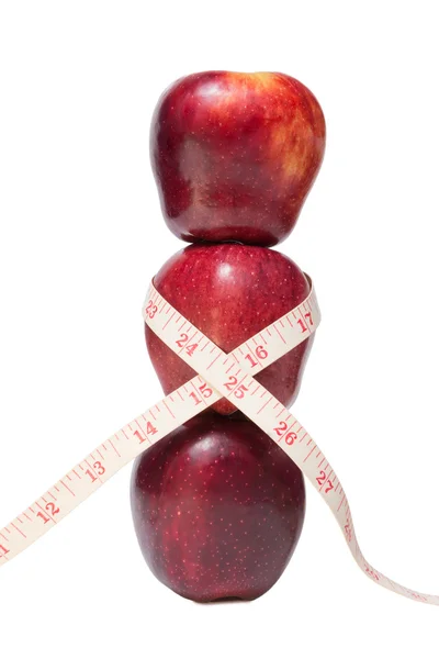 Skládaný jablka s páskou opatření — Stock fotografie