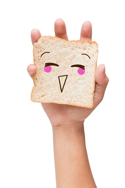 Hand holding a piece of bread with painted smiley — Stock Photo, Image