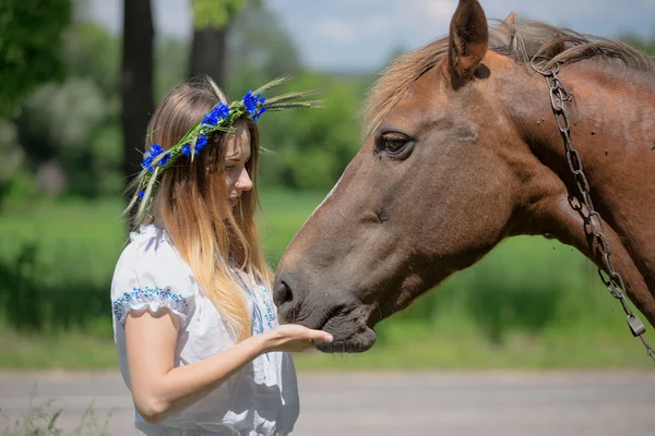 Outdoor portrait of young beautiful woman with horse — Stock Photo, Image