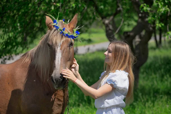 Outdoor portrait of young beautiful woman with horse — Stock Photo, Image