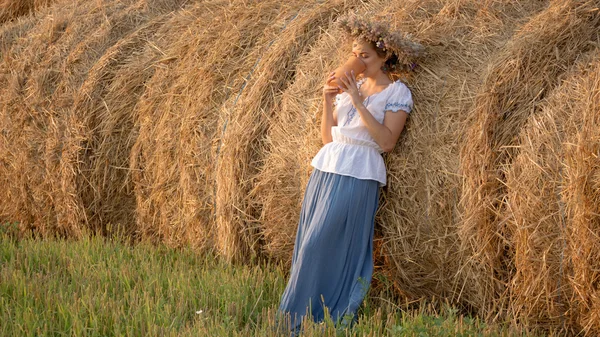 Young beautiful girl is drinking milk from a jug on the nature — Stock Photo, Image