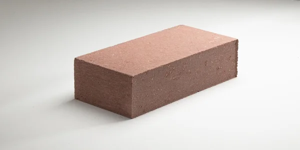 Murstein i glatt betong i forskjellige farger. på hvit bakgrunn – stockfoto