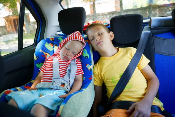 children in the car sleep in a child seat with seat belts 2020