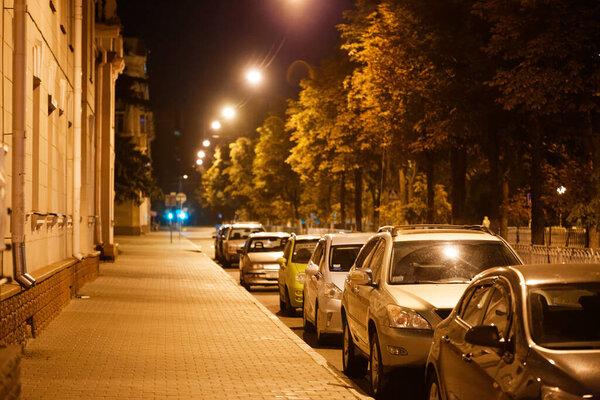 GOMEL, BELARUS - JULY 24, 2015: A row of cars parked on the evening street of the city 2020