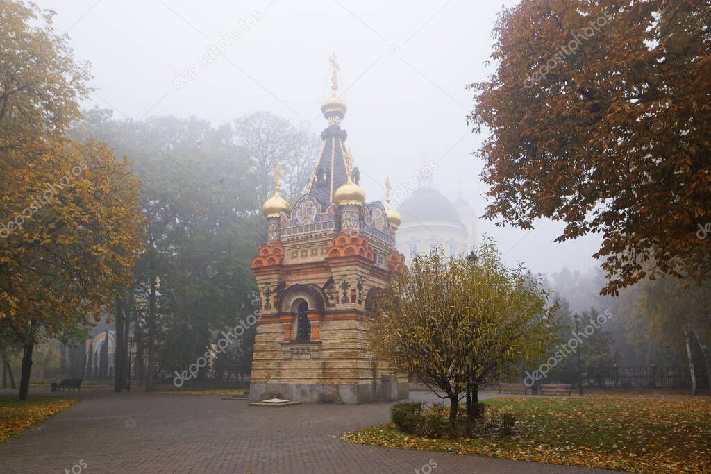 GOMEL, BELARUS - OCTOBER 23, 2015: City park in autumn in fog. Rumyantsev palace architecture 2021