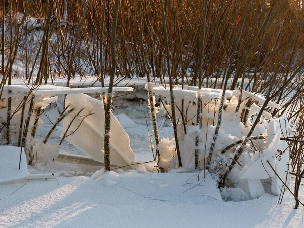 broken ice near the river bank in the cold. lower water levels break ice 2021